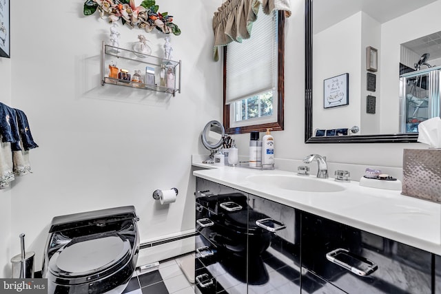 bathroom featuring tile patterned flooring, vanity, toilet, and baseboard heating