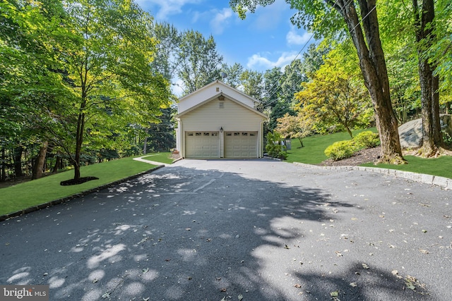 view of front of property with a garage and a front yard