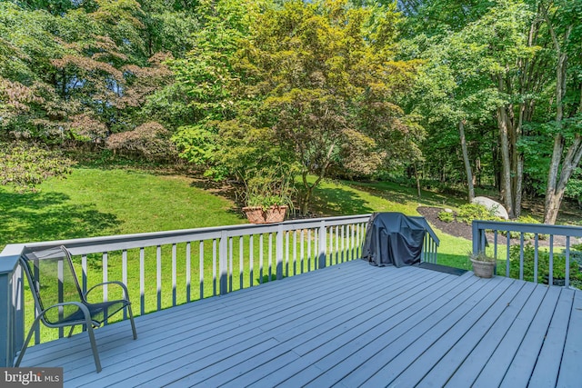 wooden terrace with a yard