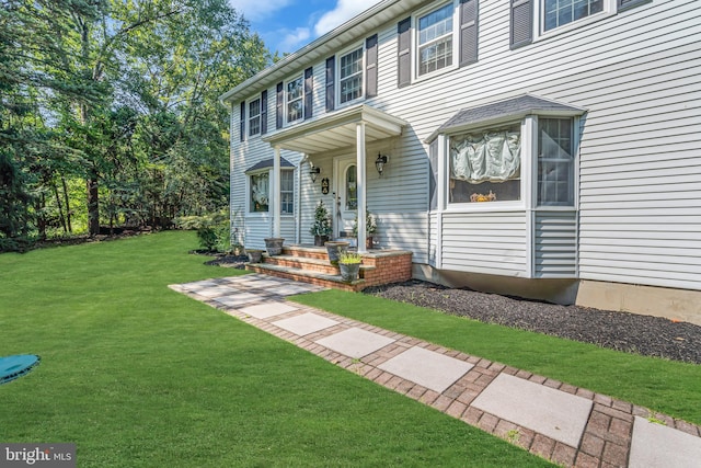 view of front of home with a front yard