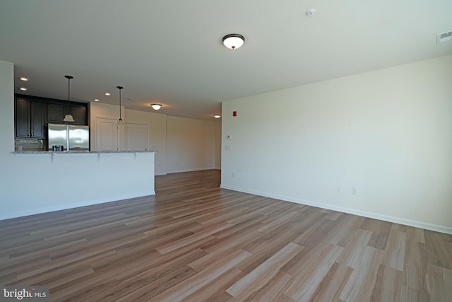 unfurnished living room featuring light wood-type flooring