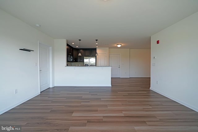 unfurnished living room with hardwood / wood-style floors