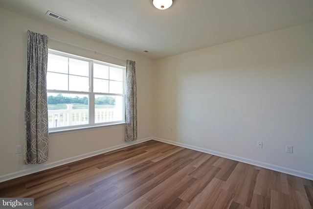 empty room featuring hardwood / wood-style flooring