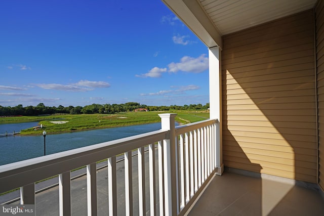 balcony featuring a water view