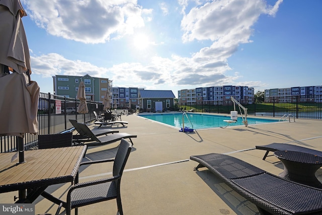 view of swimming pool with a patio area