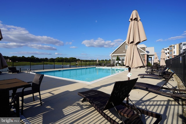 view of swimming pool featuring a patio