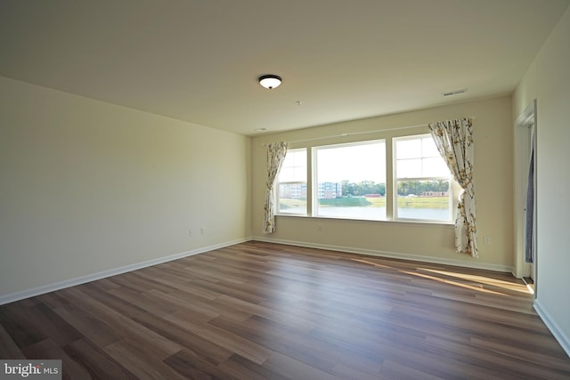 empty room with wood-type flooring