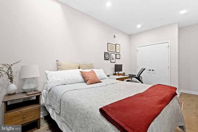 bedroom featuring hardwood / wood-style flooring