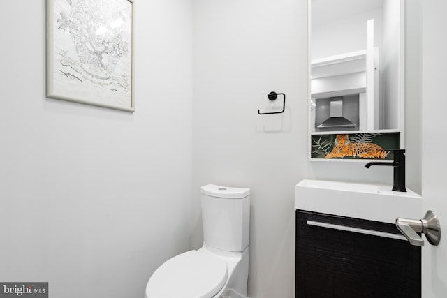 bathroom with vanity and toilet