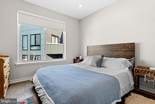 bedroom with wood-type flooring