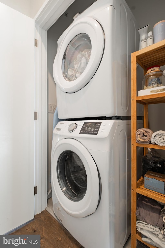 laundry area with stacked washer and clothes dryer