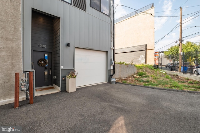 garage featuring wood walls