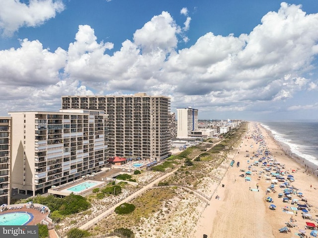 bird's eye view with a water view and a view of the beach