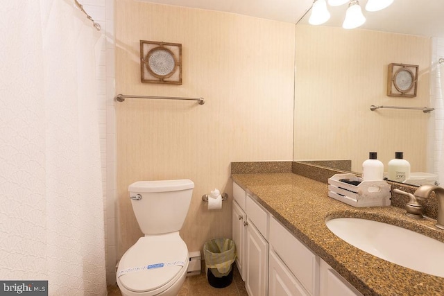 bathroom with toilet, baseboard heating, vanity, and curtained shower