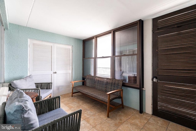 living area featuring light tile patterned flooring