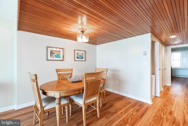 dining space featuring wood ceiling and light wood-type flooring