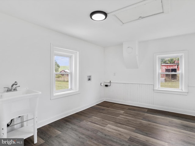 clothes washing area with hookup for a washing machine, laundry area, dark wood-style flooring, baseboards, and attic access