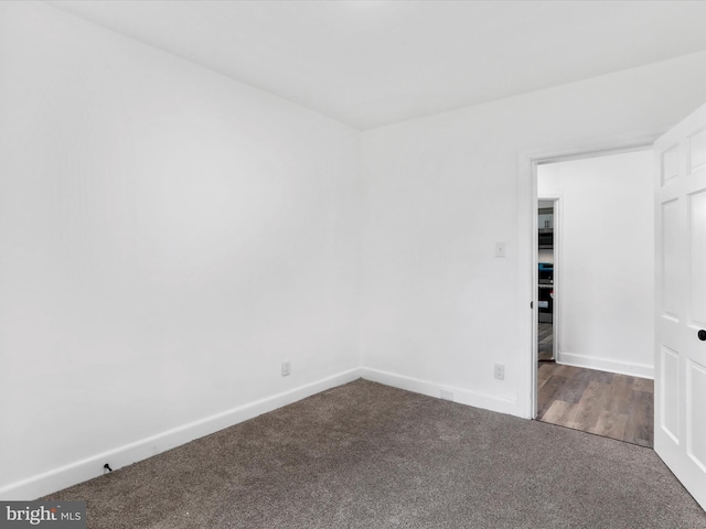 interior space with carpet flooring and baseboards