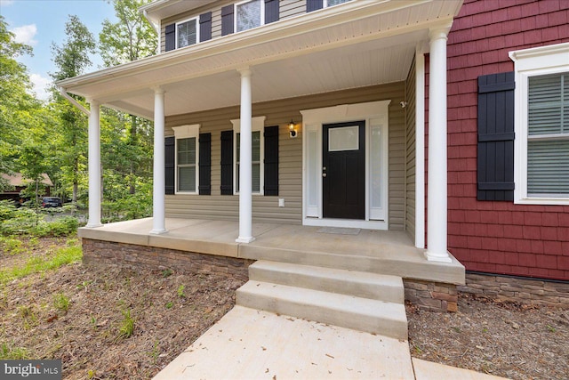 property entrance featuring a porch