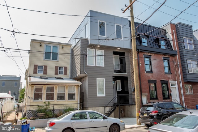 view of front of house with a balcony