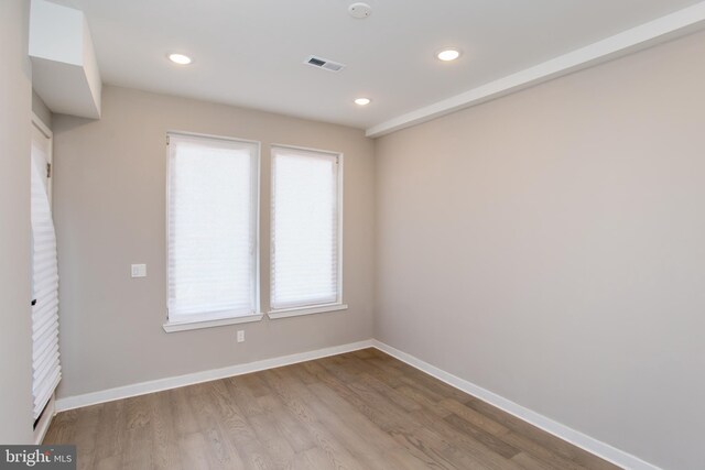 empty room featuring hardwood / wood-style flooring