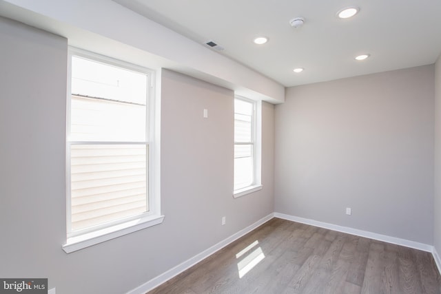 spare room featuring hardwood / wood-style flooring