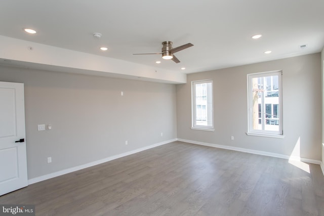 unfurnished room featuring ceiling fan and hardwood / wood-style flooring