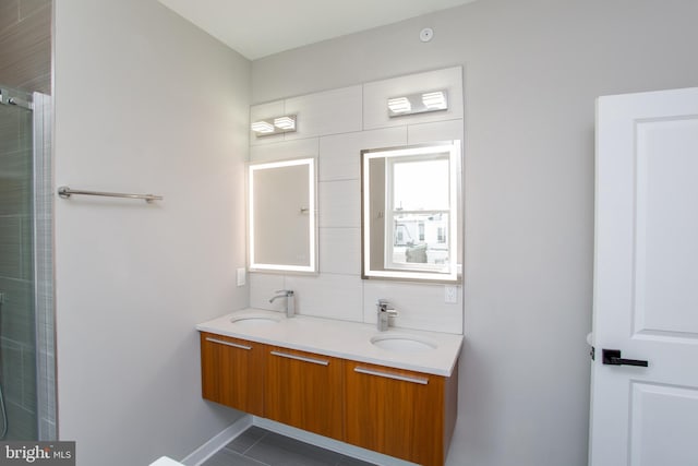 bathroom featuring tile patterned flooring, vanity, and an enclosed shower