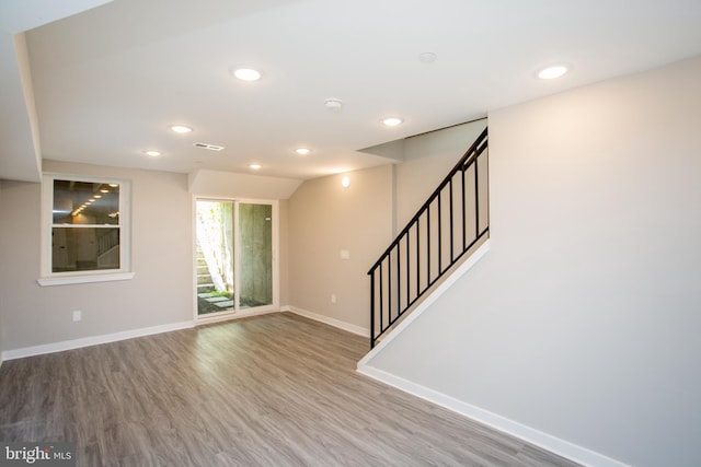 entryway with hardwood / wood-style floors