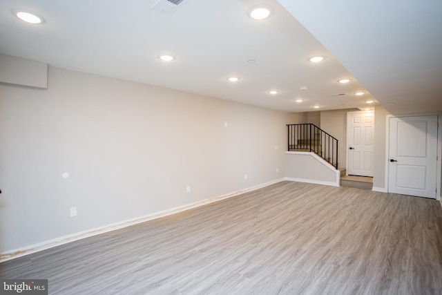 basement with wood-type flooring