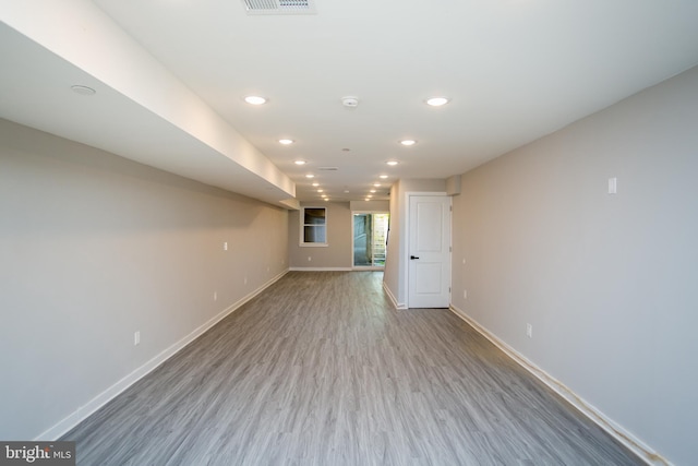 unfurnished room with hardwood / wood-style flooring