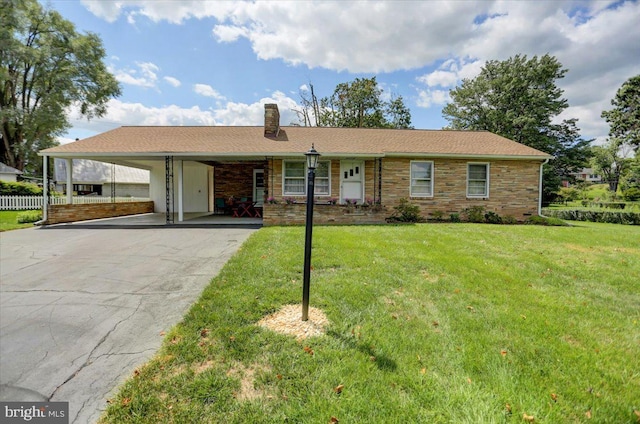 ranch-style house with a front lawn and a carport