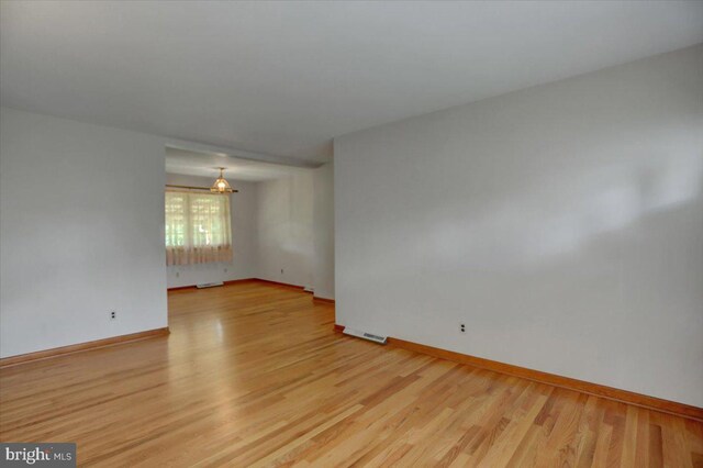 unfurnished room featuring light wood-type flooring