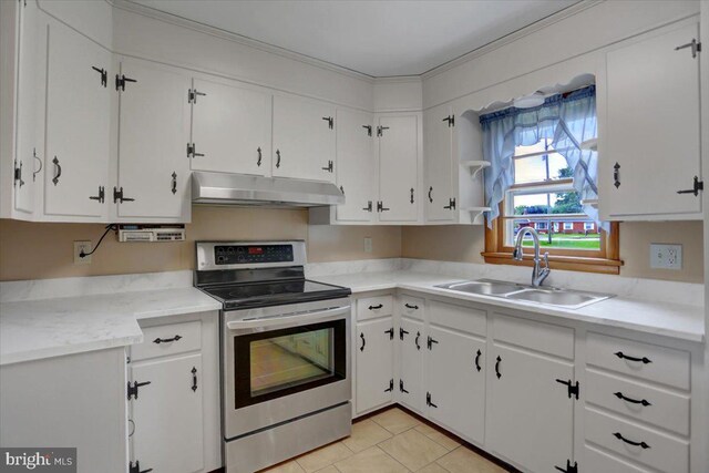 kitchen featuring sink, white cabinetry, electric stove, and light tile patterned floors