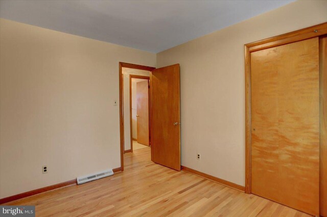 unfurnished bedroom featuring light wood-type flooring