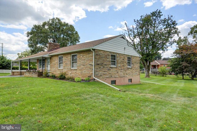 view of home's exterior with a yard