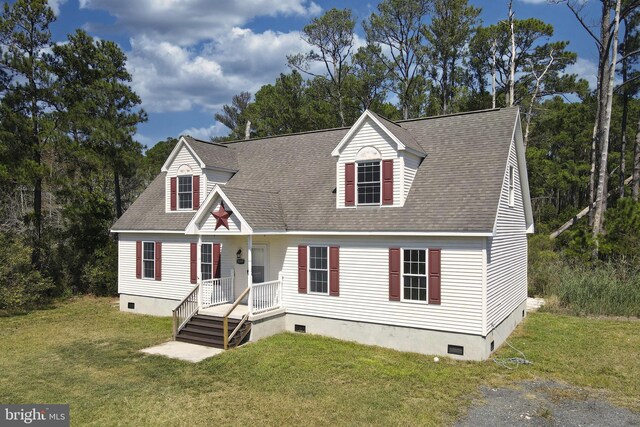 cape cod home with a front lawn