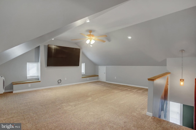 bonus room with a healthy amount of sunlight, baseboards, and carpet flooring