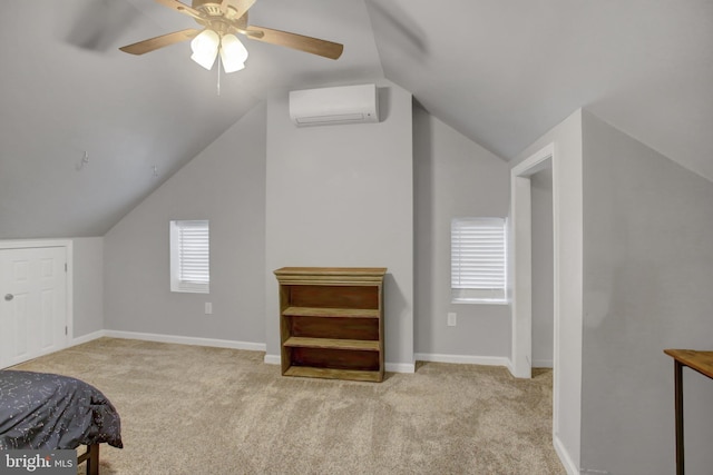 additional living space with an AC wall unit, light colored carpet, and baseboards