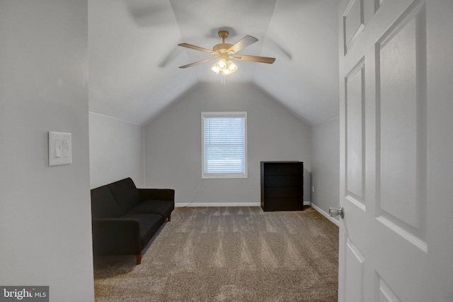 unfurnished room featuring lofted ceiling, carpet, a ceiling fan, and baseboards