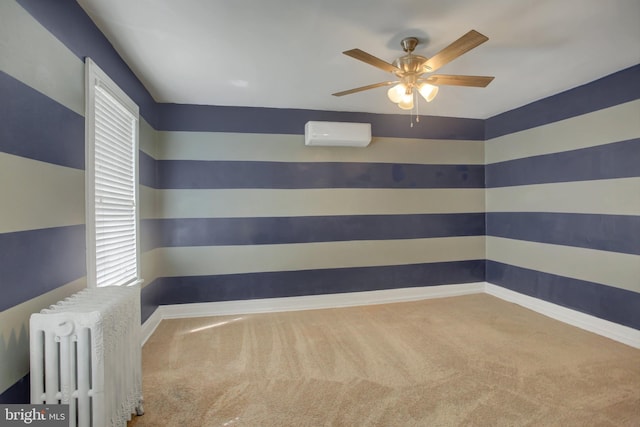 carpeted empty room with radiator heating unit, baseboards, ceiling fan, and an AC wall unit