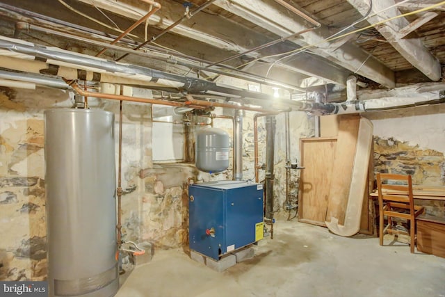 utility room featuring a heating unit and gas water heater