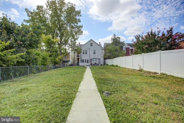 view of yard with a fenced backyard