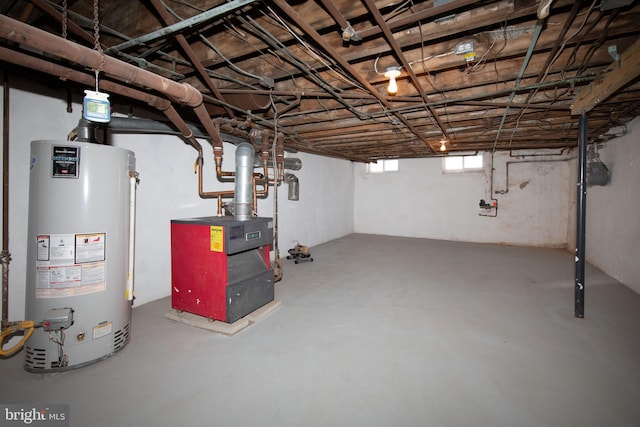 basement featuring gas water heater and heating unit