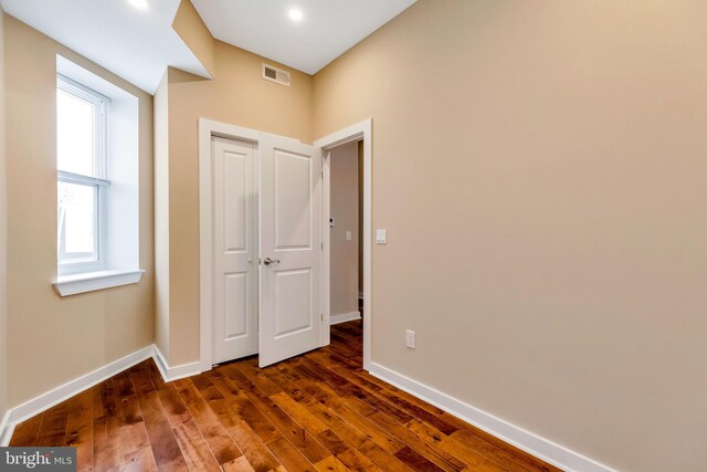 unfurnished bedroom with wood-type flooring