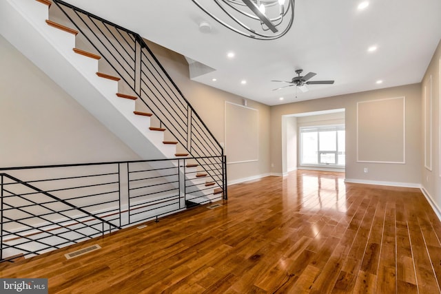 interior space with ceiling fan and hardwood / wood-style floors