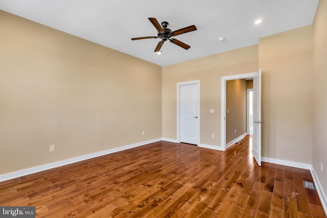 spare room featuring ceiling fan and hardwood / wood-style floors