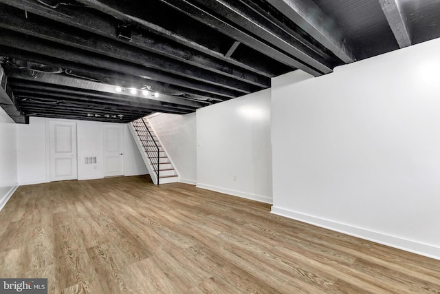 basement with wood-type flooring