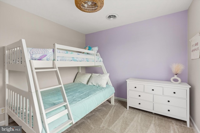 bedroom featuring visible vents, baseboards, and carpet floors