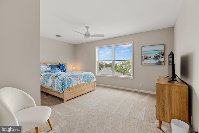 bedroom featuring visible vents, baseboards, carpet, and a ceiling fan